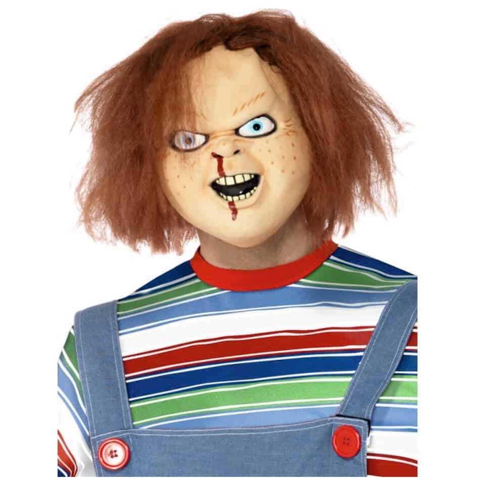 Chucky Mask – from joke.ie .Overhead Latex Mask with Realistic Hair and Terrifying Detail Get ready to scare like never before with this Chucky Mask, an overhead latex horror mask that perfectly captures the sinister look of the iconic killer doll. Crafted from high-quality natural latex, this mask features lifelike hair, detailed facial scars, and menacing blue eyes that bring Chucky’s evil grin to life. Designed for comfort and durability, it fits most adult head sizes and allows easy breathing and visibility, making it ideal for Halloween parties, horror conventions, cosplay events, or haunted houses. This realistic Chucky latex mask is hand-painted for an authentic finish, ensuring every scar and stitch looks just like the original movie character. The attached synthetic hair adds an extra layer of realism, completing the terrifying look. Whether you’re dressing up as Chucky from Child’s Play or adding to your horror collection, this mask delivers unbeatable detail and quality. Perfect for Halloween costumes, horror fans, or collectors, this Chucky mask guarantees to leave a chilling impression wherever you go. Pair it with Chucky’s classic overalls and striped shirt for the ultimate transformation. Bring your nightmares to life with the Chucky Overhead Latex Mask with Hair — the ultimate choice for true horror enthusiasts! We recommend a Wig Cap for extra comfort.  One Size Checkout more Horror Masks