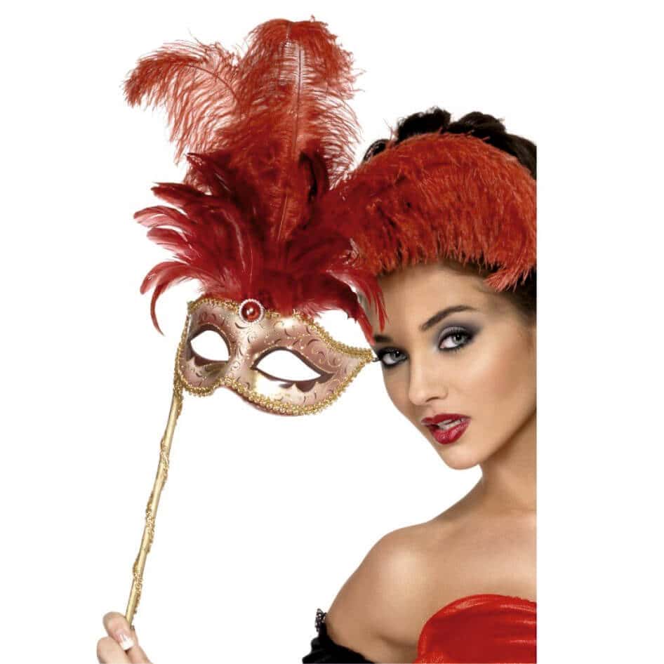 Baroque Fantasy Mask Our Baroque Fantasy Mask is both stylish and elegant.This eye mask is set on an antique gold colour stick with a plume of beautiful red feathers. The gold coloured eye mask with a hint of pink is carefully ornately designed.It feature a red stone in the centre, just above the eyes. The stick is also removable. 5 Stars for quality and design.