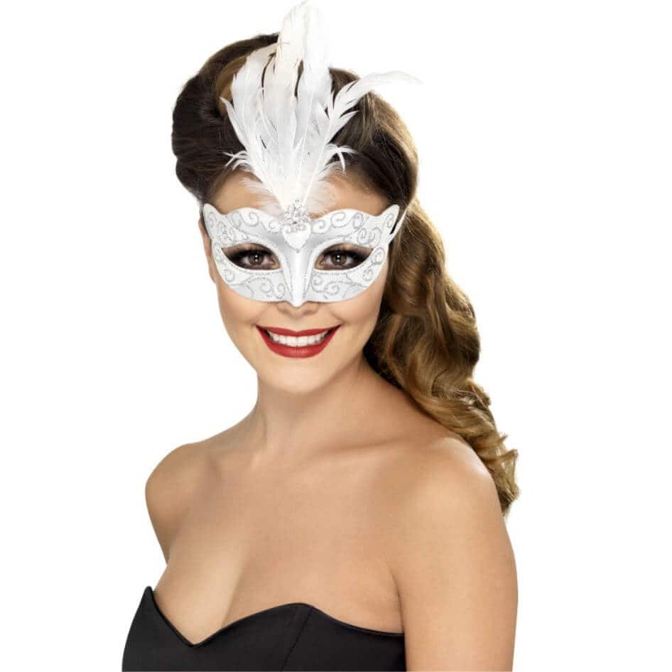 Venetian Glitter Eye Mask Simple and stylish Venetian Glitter Eye Mask with a plume of white feathers. The mask is held in place by attached mask ties.