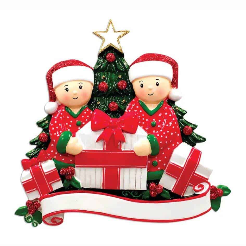 Opening Presents (Couple) Christmas Ornament from joke.ie in Cavan Ireland Our popular personalised decorations are the ideal Christmas gift to hang on the Christmas tree, and when the festive season is over pop it into the keepsake box. Hand crafted Christmas decorations in the traditional Christmas colours. Personalise it with a name or family name in the relevant field. These quality hand painted decorations are made from poly resin material and finished to a high standard with a high gloss finish.Your gift will be wrapped in tissue paper and finished with a gift bag.