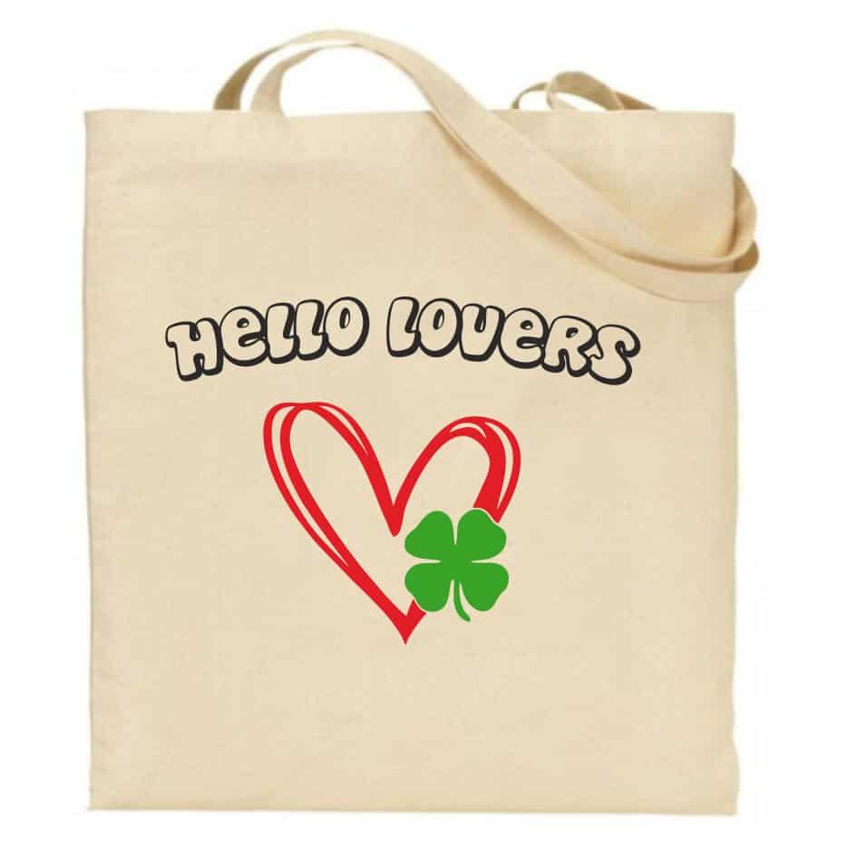 Hello Lovers from Niall Horan Tote Bag -The Show Our Niall Horan Tote Bag is ideal for all those bits and pieces that you require.The Show Live On Tour bag is a great accessory wherever you are going. Our natural colour bags are made from eco-friendly organic cotton and manufactured by a fair-trade business. Dimensions are 39(h) x 35(w) with 30cm handle and features a double Hello Lovers print.