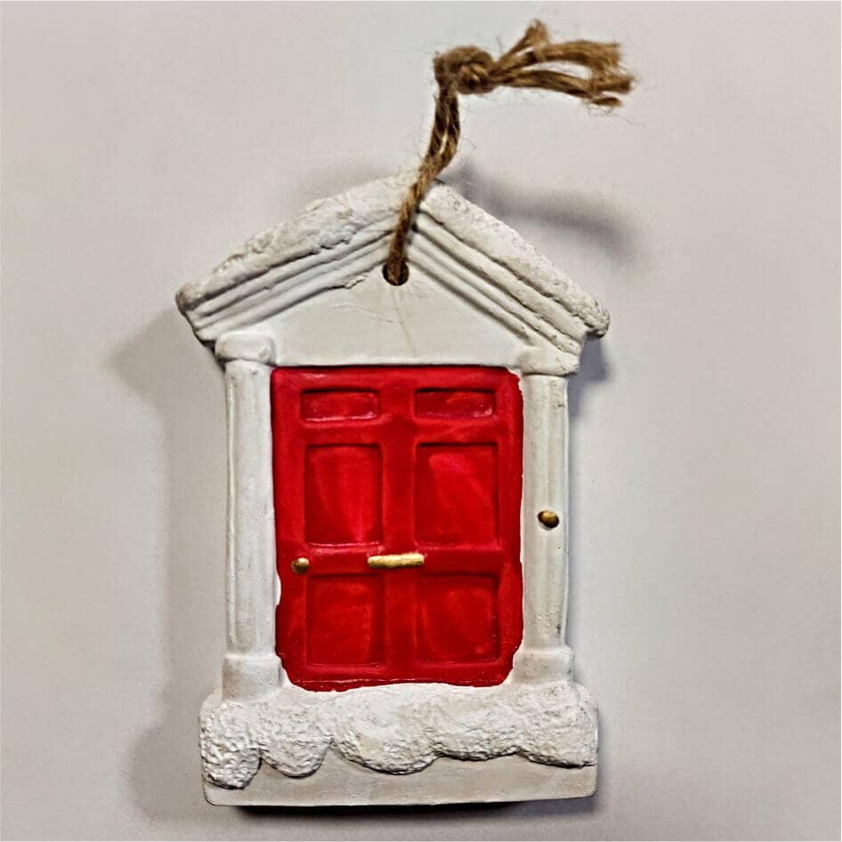 Red Door Personalised Christmas Decoration from joke.ie in Cavan Ireland Our popular personalised decorations are the ideal Christmas gift to hang on the Christmas tree, and when the festive season is over pop it into the keepsake box. Hand crafted Christmas  decorations in the traditional Christmas colours. Personalise it with a name or family name in the relevant field. These quality hand painted decorations are made from poly resin material and finished to a high standard with a high gloss finish.Your gift will be wrapped it tissue paper and finished in a gift bag.
