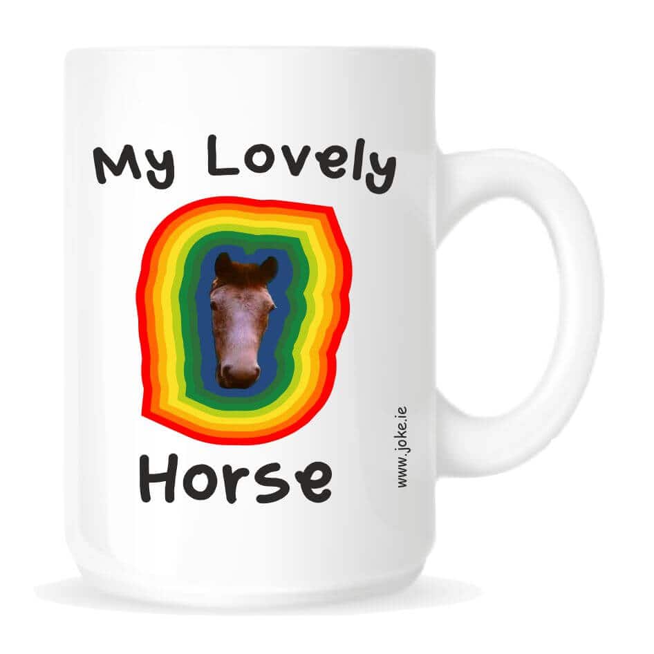 My Lovely Horse Mug from joke.ie..Eurostar from Father Ted - My Lovely Horse by Ted And Dougal. Our mug is ideal for your tea or coffee.Novelty mug with a fun slogan and image,"My Lovely Horse Mug " Our novelty fun mugs are an everyday use mug. The 10oz ceramic mugs are manufactured with a dishwasher safe premium coating.They are dishwasher resistant up to 800 wash cycles at 45°C.Our deluxe 14oz Travel mugs are ideal for anyone on the move, these travel mugs are stainless steel and will last for years. The mugs keep liquid hot or cold. Our mugs are of a high gloss finish and are available in four sizes. Standard 10oz Mug Fine Enamel Mug 12oz Jumbo 15oz Mug – Ideal for anyone that loves a good cuppa! Travel 14oz Mug – Great for anyone on the move. All mugs come in a gift box