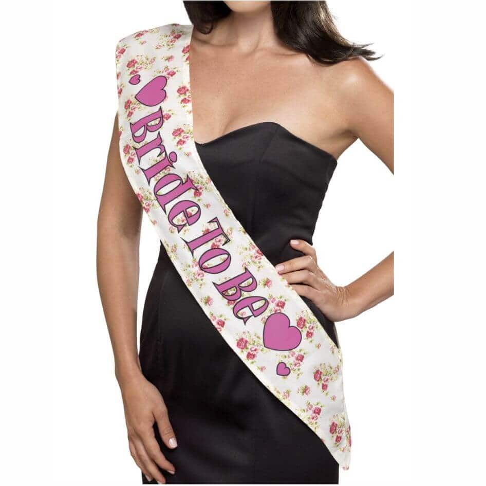Vintage Bride To Be Sash from joke.ie and the Joke Shop Cavan Stylish Vintage Bride To Be Sash is a must or any lady who loves all things vintage.Our classic vintage style sash has a floral rose print and 'Bride to Be' print in pink with a black outline.Checkout our range of hen night goodies.Go on ya will!
