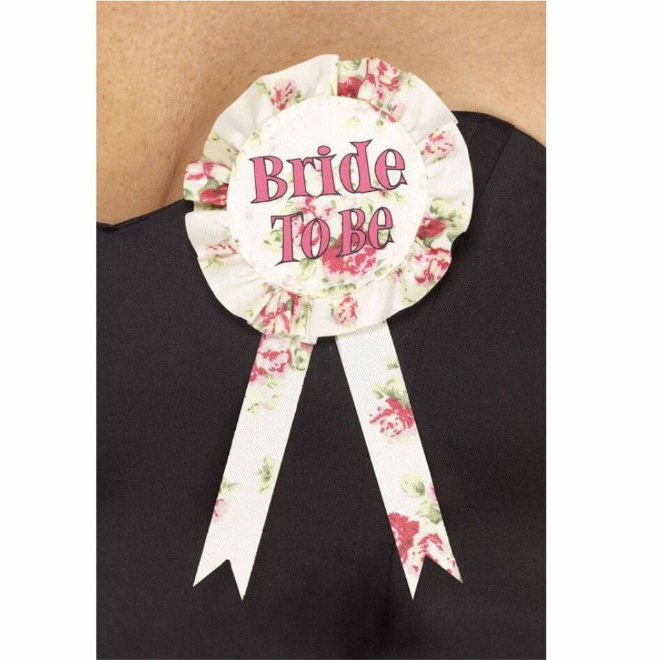Vintage Bride To Be Rosette from joke.ie Ireland Floral design bride to be rosette with safety pink on the rear for easy attachment to your clothing.Checkout our full range of hen party novelty items.