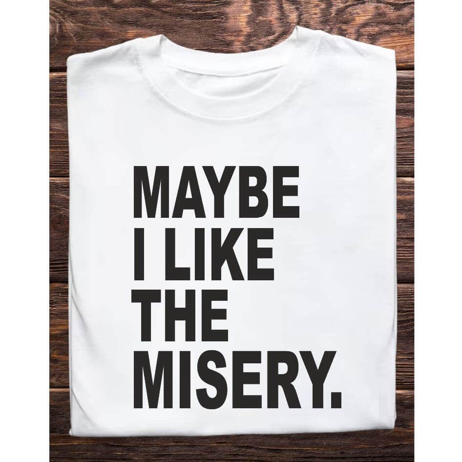 Father Ted Themed: Maybe I Like the Misery Tee Shirt from Joke.ie, Ireland. Delight in the iconic humor of Father Ted with our Maybe I Like the Misery Tee Shirt. Perfect for fans who cherish the series' unique and memorable moments, this t-shirt captures the essence of one of Father Jack's most unforgettable lines. Design and Style The Maybe I Like the Misery Tee Shirt features a bold and straightforward design that pays homage to one of the show's classic moments. The front of the shirt prominently displays the phrase "Maybe I Like the Misery" in a striking font, evoking the gritty and humorous tone of Father Jack's character. The minimalist design keeps the focus on the iconic quote, making it instantly recognizable to fans of the show. Material and Comfort Crafted from high-quality, 100% cotton, this t-shirt offers superior comfort and durability. The soft, breathable fabric ensures a cozy fit, perfect for everyday wear or special occasions. The material is pre-shrunk, ensuring the shirt maintains its shape and size even after multiple washes, providing long-lasting enjoyment. Humorous and Nostalgic Wearing the "Maybe I Like the Misery" T-Shirt is a fun way to celebrate the edgy humor of Father Ted. The design brings to life one of Father Jack's most iconic lines, evoking laughter and fond memories of the show's funniest moments. It's a subtle yet impactful way to show your appreciation for the series and connect with other fans who recognize the reference. Versatile and Stylish This t-shirt pairs well with jeans, shorts, or even pajama bottoms for a relaxed, casual look. Its classic fit makes it suitable for any occasion, whether you're heading to a comedy night, hanging out with friends, or simply relaxing at home. The bold design ensures you'll stand out and make a statement wherever you go. Perfect Gift for Fans Looking for the perfect gift for a Father Ted aficionado? The "Maybe I Like the Misery" T-Shirt is an excellent choice. Its unique design and high-quality construction make it a thoughtful and enjoyable present for birthdays, holidays, or any special occasion. Celebrate the wit and nostalgia of Father Ted with the Maybe I Like the Misery Tee Shirt. Featuring the iconic line from Father Jack, this shirt is a must-have for any fan of the show. Enjoy the comfort of premium cotton and the joy of sharing your favorite TV moments with the world. Get your "Maybe I Like the Misery" T-Shirt today and add a touch of Craggy Island humor to your wardrobe! Colour: White loose fit tee Size: Small 35/37″ Medium 38/40″ Large 41/43″ X Large 44/46″ 2X Large 47/49″ 3X Large 50/522 View our entire Father Ted Collection here.