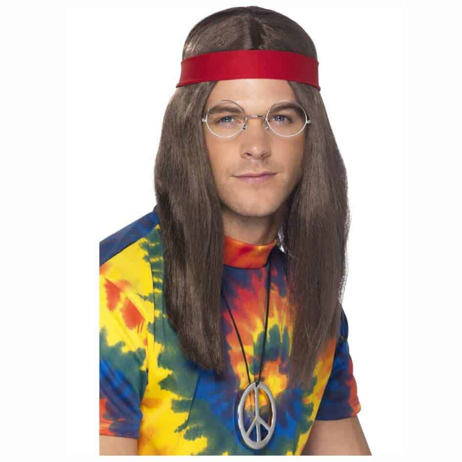 Hippy Man Kit from Joke.ie, Ireland. Groove Back to the '60s with Our Ultimate Hippy Man Kit! Transport yourself to the era of peace, love, and harmony with our Hippy Man Kit! Perfect for costume parties, retro-themed events, music festivals, or simply embracing the laid-back vibes of the '60s, this kit includes everything you need to transform into the quintessential hippy. The kit features a groovy wig, a peace sign medallion, a red headband, and circular spectacles. Key Features: Groovy Wig: The kit includes a long, shaggy wig that captures the iconic hippy hairstyle. The natural-looking hair gives you an effortlessly cool and carefree look, perfect for embodying the spirit of the '60s. Peace Sign Medallion: The large, eye-catching peace sign medallion is a must-have accessory for any true hippy. The medallion hangs on a durable chain, making it a bold statement piece that completes your retro ensemble. Red Headband: The classic red headband ties around your head, adding a pop of color and authenticity to your outfit. It’s adjustable to fit comfortably and stay securely in place, enhancing your hippy look. Circular Spectacles: No hippy outfit is complete without the iconic circular spectacles. These retro-style glasses feature round lenses and thin frames, perfectly capturing the hippy aesthetic and adding a touch of vintage flair to your appearance. Perfect For: Costume Parties and Themed Events: Be the star of any costume party or themed event with your authentic hippy look. This kit provides all the essential accessories to transform you into a convincing '60s hippy, ensuring you stand out and spread positive vibes. Music Festivals and Concerts: Embrace the festival spirit with the Hippy Man Kit. Perfect for music festivals, concerts, or any event where you want to channel the peace-loving hippy vibe and connect with fellow free spirits. Retro and Decade Parties: Ideal for retro or decade-themed parties, the Hippy Man Kit helps you effortlessly capture the essence of the '60s. Relive the era of peace and love with a look that’s both nostalgic and fun. Why Choose Our Hippy Man Kit? Our Hippy Man Kit is more than just a costume; it’s a way to embrace the carefree, peace-loving spirit of the '60s. Whether you’re dressing up for a party, festival, or simply want to spread positive vibes, this kit provides all the essential accessories to create an authentic and memorable hippy look. The high-quality components ensure that you look fantastic and feel comfortable, making it the perfect choice for any retro-themed adventure. Order your kit today and step into a world of peace, love, and groovy fun! Shop our full accessories collection here!