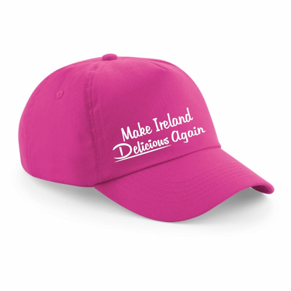Pink - Make Ireland Delicious Again Cap from joke.ie Ireland. "Make Ireland Delicious Again" Cap – Premium 5-Panel Peaked Cap Add a touch of humor and Irish pride to your wardrobe with this "Make Ireland Delicious Again" cap! Whether you're passionate about your Country, Irish food, love a good laugh, or just want a standout accessory, this high-quality 5-panel peaked cap is the perfect choice. Crafted from premium, durable materials, this cap offers a structured fit with reinforced stitching and a curved peak for excellent sun protection. The embroidered "Make Ireland Delicious Again" slogan adds a stylish and long-lasting touch, making it a great conversation starter. Featuring an adjustable strap, this cap ensures a comfortable, one-size-fits-all fit, perfect for both men and women. Ideal for food lovers, Irish culture enthusiasts, chefs, festival-goers, and anyone with a sense of humor, this cap is perfect for casual wear, St. Patrick’s Day celebrations, food festivals, and everyday outings. The breathable, lightweight fabric makes it a great all-season accessory. Order your "Make Ireland Delicious Again" cap today and celebrate Ireland’s rich food culture with style and wit. Whether for yourself or as a fun gift, this cap is guaranteed to turn heads and bring smiles! Size Adjustable - Colours: Green - Pink