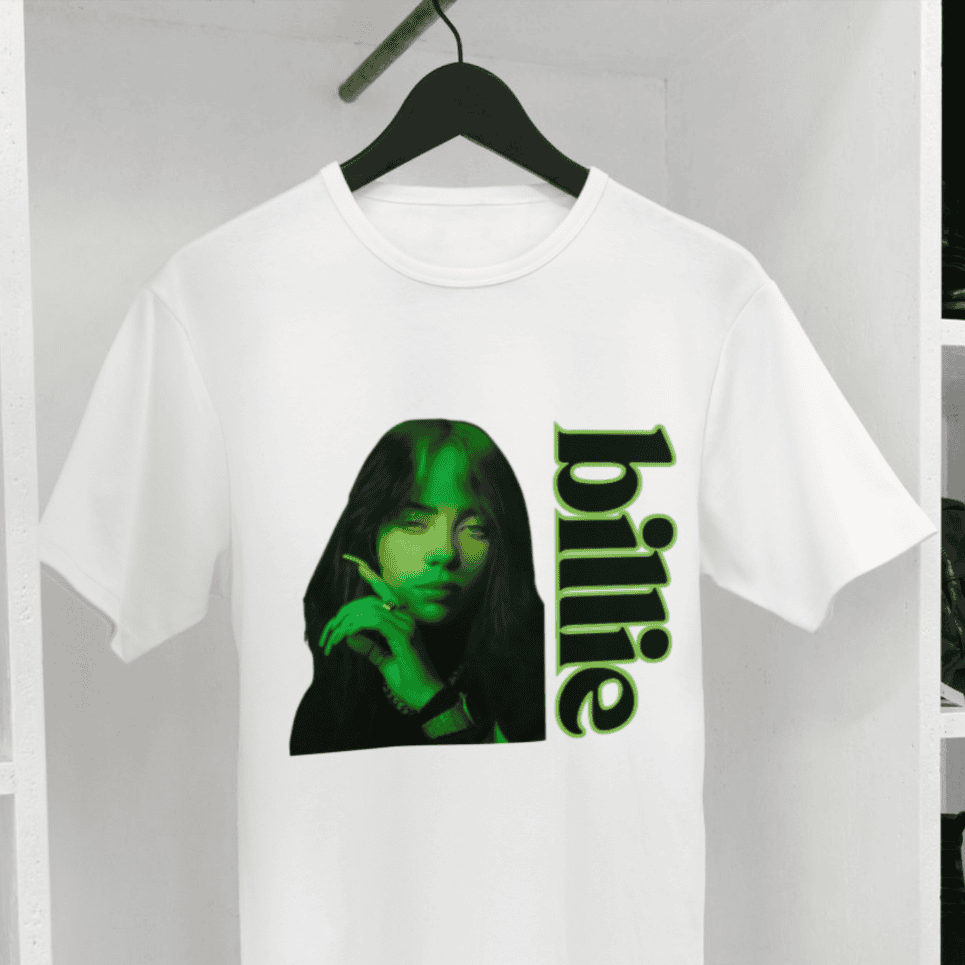 Billie Eilish T-shirt from Joke.ie with green and black photo and “Billie” written in black with green outline.