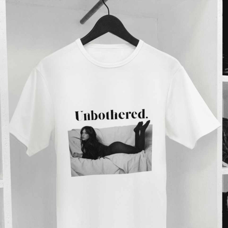 Camila Cabello T-shirt from Joke.ie with photo of her lying on a couch and “unbothered.” text above.