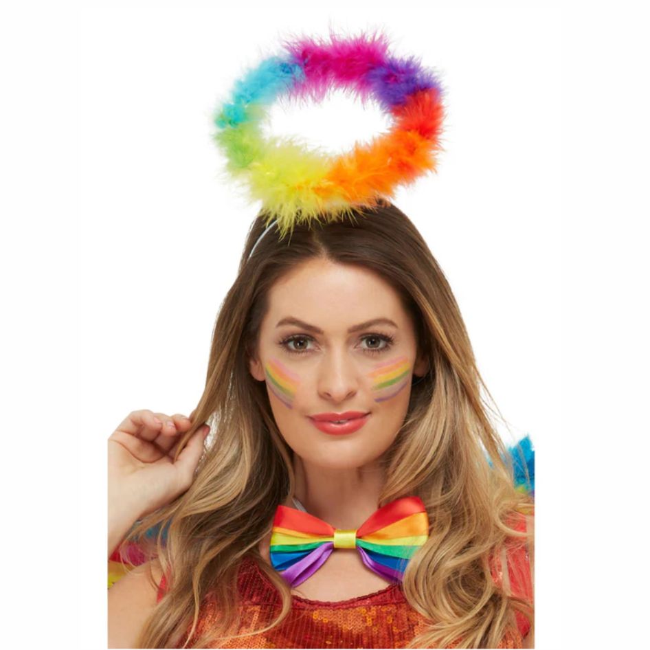 Rainbow Angel Halo – Feather Style with Adjustable Headband from joke.ie. Light up any event with this dazzling Rainbow Angel Halo, featuring vibrant multi-coloured feathers and a sturdy wire frame for lasting shape and comfort. Designed to radiate joy and positivity, this rainbow feather halo is the perfect accessory to make you stand out at any party, concert, festival, or themed event. The strong wire construction keeps the halo perfectly balanced, while the matching adjustable headband ensures a secure and comfortable fit for both adults and children. Whether you’re dressing up as a colourful angel, fairy, or festival performer, this bright and cheerful halo adds the finishing touch to your outfit. Lightweight, durable, and easy to wear, the rainbow halo headband stays in place so you can dance, perform, or celebrate with confidence. Pair it with rainbow wings, glitter makeup, or a vibrant costume for an unforgettable look full of sparkle and fun. Perfect for concerts, pride events, fancy dress parties, or stage performances, this rainbow angel halo brings colour and creativity to every occasion. Spread good vibes and let your true colours shine with this eye-catching halo that celebrates individuality, joy, and the magic of self-expression. Checkout more great Angel Accessories